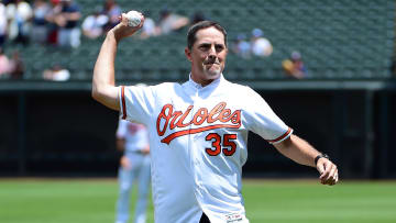 Jun 30, 2019; Baltimore, MD, USA; Former Baltimore Orioles pitcher Mike Mussina (35) throws out the first pitch prior to the game against the Cleveland Indians at Oriole Park at Camden Yards.