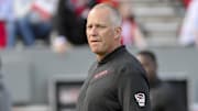 Nov 2, 2024; Raleigh, North Carolina, USA; North Carolina State Wolfpack head coach Dave Doeren during pregame warm up against Stanford Cardinals at Carter-Finley Stadium. Mandatory Credit: Zachary Taft-Imagn Images