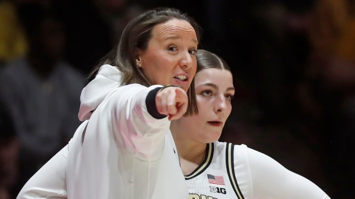 Purdue Boilermakers head coach Katie Gearlds talks to Purdue Boilermakers guard Sophie Swanson 