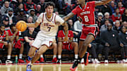 Feb 5, 2025; Piscataway, New Jersey, USA; Illinois Fighting Illini forward Will Riley (7) is defended by Rutgers Scarlet Knights forward Bryce Dortch (8) during the first half at Jersey Mike's Arena. Mandatory Credit: Vincent Carchietta-Imagn Images