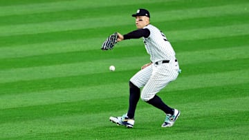 Oct 30, 2024; Bronx, New York, USA;  New York Yankees outfielder Aaron Judge (99) drops a fly ball during the fifth inning against the Los Angeles Dodgers during game five of the 2024 MLB World Series at Yankee Stadium. Mandatory Credit: James Lang-Imagn Images
