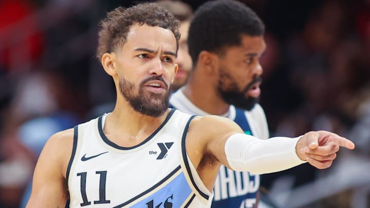 Trae Young #11 of the Atlanta Hawks reacts during a game against the Dallas Mavericks.