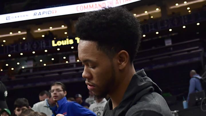 Feb 1, 2026; Boston, Massachusetts, USA; Boston Celtics guard Anfernee Simons (4) signs an autograph prior to a game against the Milwaukee Bucks at TD Garden. Mandatory Credit: Bob DeChiara-Imagn Images