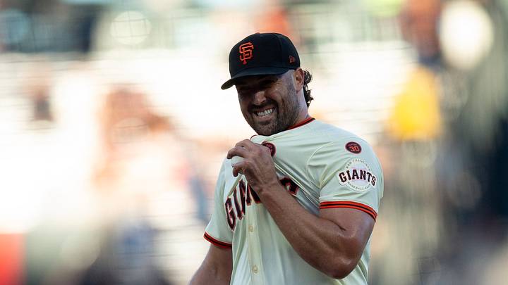 San Francisco, California, USA; San Francisco Giants starting pitcher Robbie Ray reacts to allowing a walk against the Atlanta Braves during the first inning at Oracle Park. Mandatory Credit: D. Ross Cameron-USA TODAY Sports