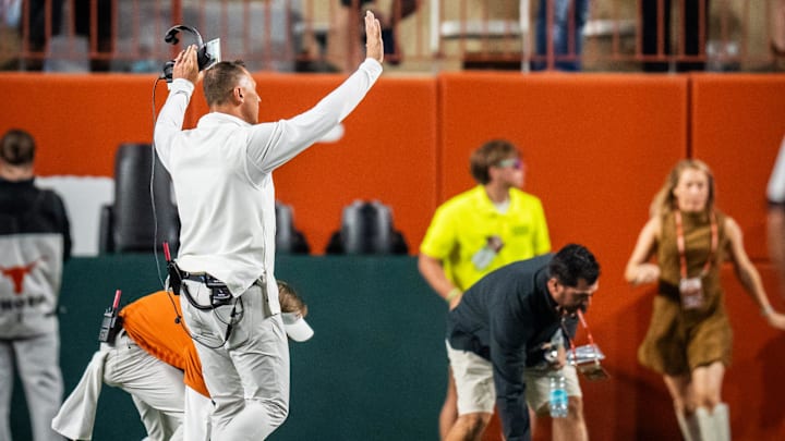 Texas Longhorns head coach Steve Sarkisian walks over to the student section to encourage them to stop throwing items on the field after a controversial call by the referees that was later reversed after a review in the third quarter of the Longhorns' game against the Georgia Bulldogs at Darrell K. Royal-Texas Memorial Stadium in Austin, Oct. 19, 2024.