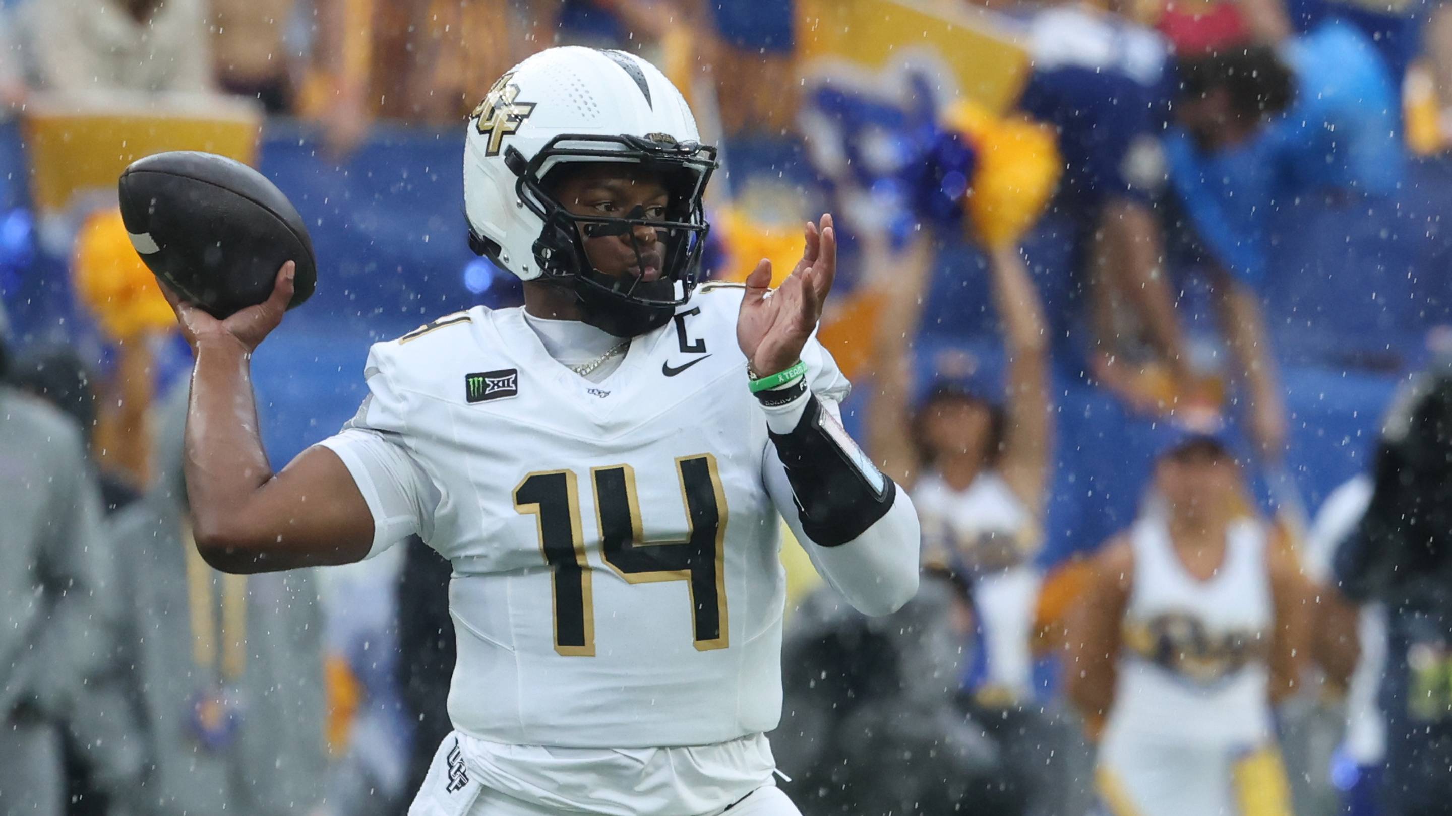Sep 12, 2026; Pittsburgh, Pennsylvania, USA; UCF Knights quarterback Alonza Barnett III (14) passes against the Pittsburgh Panthers during the first quarter at Acrisure Stadium. Mandatory Credit: Charles LeClaire-Imagn Images | IMAGN IMAGES via Reuters Connect
