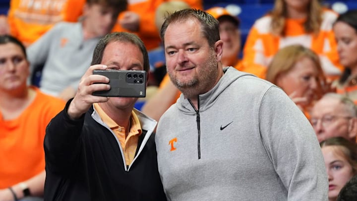 A Tennessee fan takes a photos with Tennessee football coach Josh Heupel at the NCAA Tournament Elite Eight game between Tennessee and Houston at Lucas Oil Stadium in Indianapolis, Ind., on Sunday, March 30, 2025. A Tennessee fan takes a photos with Tennessee football coach Josh Heupel at the NCAA Tournament Elite Eight game between Tennessee and Houston at Lucas Oil Stadium in Indianapolis, Ind., on Sunday, March 30, 2025.