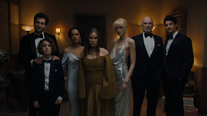 Something Very Bad Is Going To Happen. (L to R) Jeff Wilbusch as Jules, Sawyer Fraser as Jude, Karla Crome as Nell, Jennifer Jason Leigh as Victoria, Gus Birney as Portia, Ted Levine as Boris, Adam DiMarco as Nicky Cunningham in episode 107 of Something Very Bad Is Going To Happen. Cr. Courtesy of Netflix © 2026