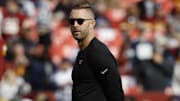 Nov 24, 2024; Landover, Maryland, USA; Washington Commanders offensive coordinator Kliff Kingsbury stands on the field during warmup prior to the game against the Dallas Cowboys at Northwest Stadium. Mandatory Credit: Geoff Burke-Imagn Images