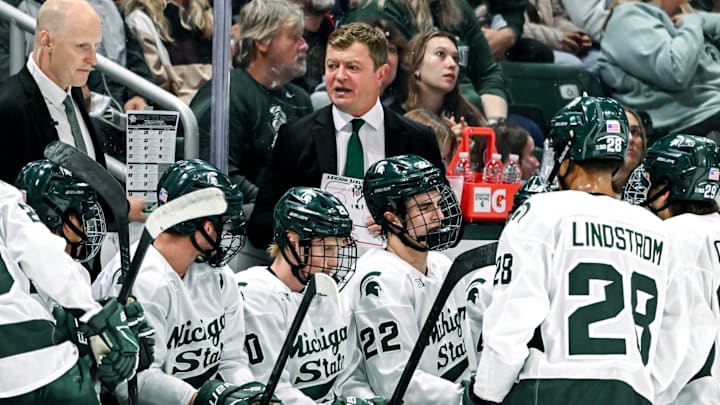 Michigan State's head coach Adam Nightingale, center, talks with the team during a break in the action in the first period of the game against New Hampshire on Thursday, Oct. 9, 2025, at Munn Ice Arena in East Lansing. Michigan State's head coach Adam Nightingale, center, talks with the team during a break in the action in the first period of the game against New Hampshire on Thursday, Oct. 9, 2025, at Munn Ice Arena in East Lansing.