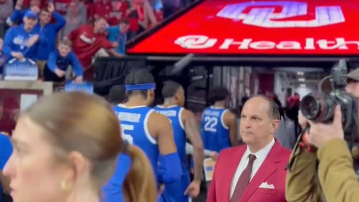 A beer can flies past the head of Kentucky’s Barndon Garrison.