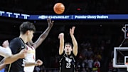 Jan 21, 2025; Ames, Iowa, USA;  UCF Knights guard Nils Machowski (22) shoots against the Iowa State Cyclones during the second half at James H. Hilton Coliseum. Mandatory Credit: Reese Strickland-Imagn Images