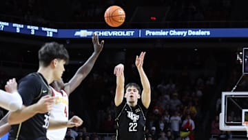 Jan 21, 2025; Ames, Iowa, USA;  UCF Knights guard Nils Machowski (22) shoots against the Iowa State Cyclones during the second half at James H. Hilton Coliseum. Mandatory Credit: Reese Strickland-Imagn Images