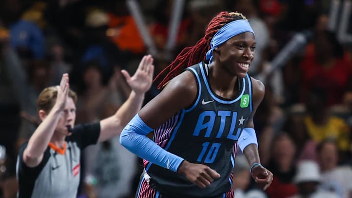 Sep 5, 2025; College Park, Georgia, USA; Atlanta Dream guard Rhyne Howard (10) smiles after shooting a three point shot against the Los Angeles Sparks during the first quarter at Gateway Center Arena at College Park. Mandatory Credit: Jordan Godfree-Imagn Images