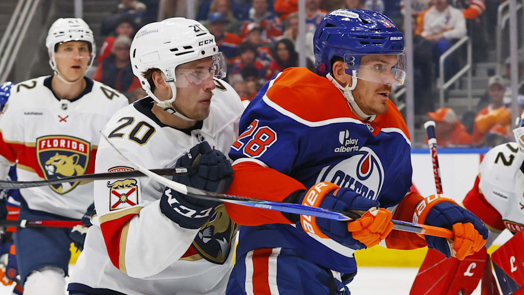 Mar 19, 2026; Edmonton, Alberta, CAN; Florida Panthers defensemen Mike Benning (20) and Edmonton Oilers forward Jack Roslovic (28) skate after the puck during the third period at Rogers Place. Mandatory Credit: Perry Nelson-Imagn Images Mar 19, 2026; Edmonton, Alberta, CAN; Florida Panthers defensemen Mike Benning (20) and Edmonton Oilers forward Jack Roslovic (28) skate after the puck during the third period at Rogers Place. Mandatory Credit: Perry Nelson-Imagn Images