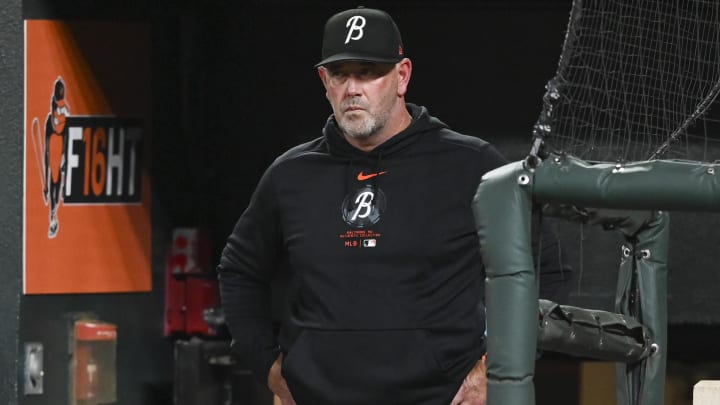 Jul 26, 2024; Baltimore, Maryland, USA;  Baltimore Orioles manager Brandon Hyde (18) stands in the dugout during the eighth inning of there game against the San Diego Padres at Oriole Park at Camden Yards