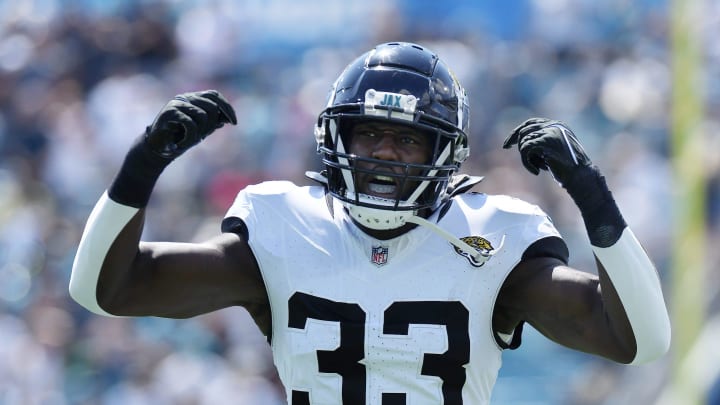 Jacksonville Jaguars linebacker Devin Lloyd (33) tries to get the fans in the north end zone fired up before the opening kickoff. The Jacksonville Jaguars hosted the Houston Texans at EverBank Stadium in Jacksonville, Fla. Sunday, September 24, 2023. The Jaguars trailed 17 to 0 at the end of the first half. [Bob Self/Florida Times-Union]