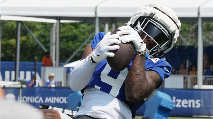 East Rutherford, NJ -- August 1, 2024 -- Wide receiver Malik Nabers makes this TD catch from a Daniel Jones pass during practice today at the New York Giants' training camp.