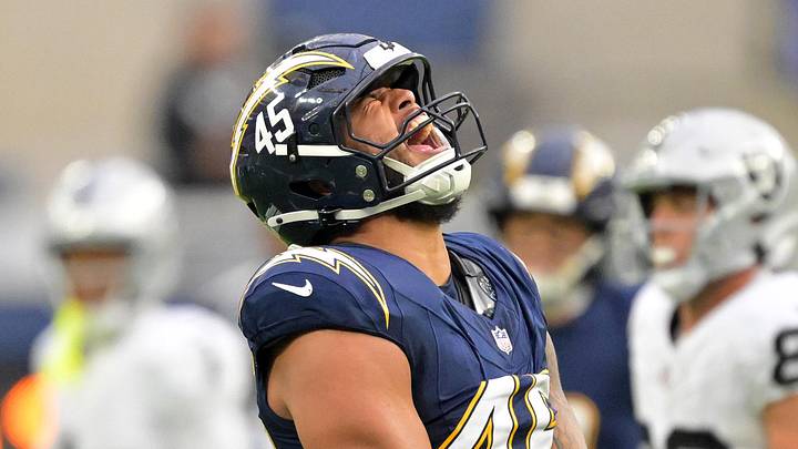 Nov 30, 2025; Inglewood, California, USA; Los Angeles Chargers linebacker Tuli Tuipulotu (45) reacts after a sack against the Las Vegas Raiders during the second half at SoFi Stadium. Mandatory Credit: Jayne Kamin-Oncea-Imagn Images