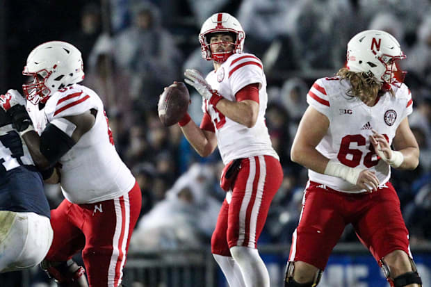 Nebraska Cornhuskers quarterback Tanner Lee (13) looks to throw a pass.