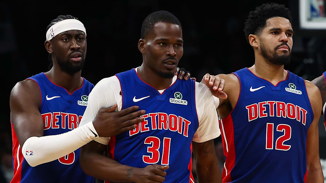 Dec 15, 2025; Boston, Massachusetts, USA; Teammates Detroit Pistons forward Tobias Harris (12) and guard Caris Levert (8) go over to guard Javonte Green (31) after he was called for a technical foul against the Boston Celtics during the second half at TD Garden. Mandatory Credit: Winslow Townson-Imagn Images