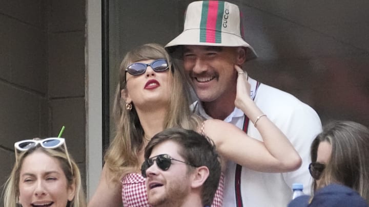 Artist Taylor Swift and Kansas City Chiefs tight end Travis Kelce talk during the men’s singles final of the 2024 U.S. Open