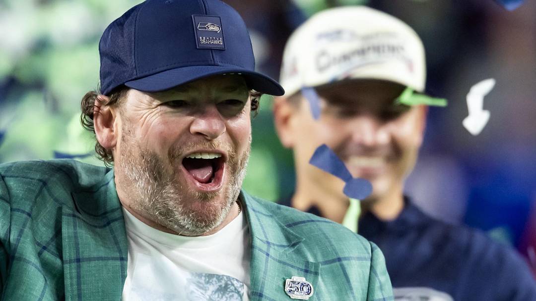 Seattle Seahawks general manager John Schneider celebrates with the Vince Lombardi trophy