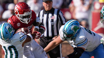 Oklahoma Sooners wide receiver Deion Burks (6) is brought down by Tulane Green Wave defensive back Lu Tillery (10) and Tulane Green Wave defensive end Parker Petersen (98) during a college football game between the University of Oklahoma Sooners (OU) and the Tulane Green Wave at Gaylord Family - Oklahoma Memorial Stadium in Norman, Okla., Saturday, Sept. 14, 2024.