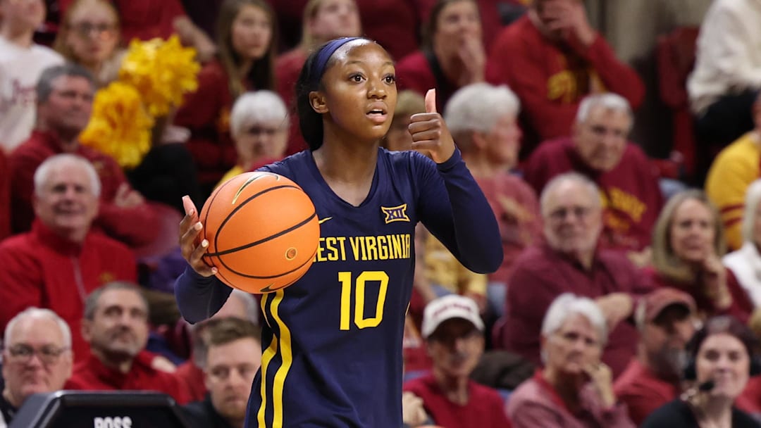 Jan 11, 2026; Ames, Iowa, USA; West Virginia Mountaineers guard Jordan Harrison (10) sets the offense against the Iowa State Cyclones during the second half at James H. Hilton Coliseum. Mandatory Credit: Reese Strickland-Imagn Images