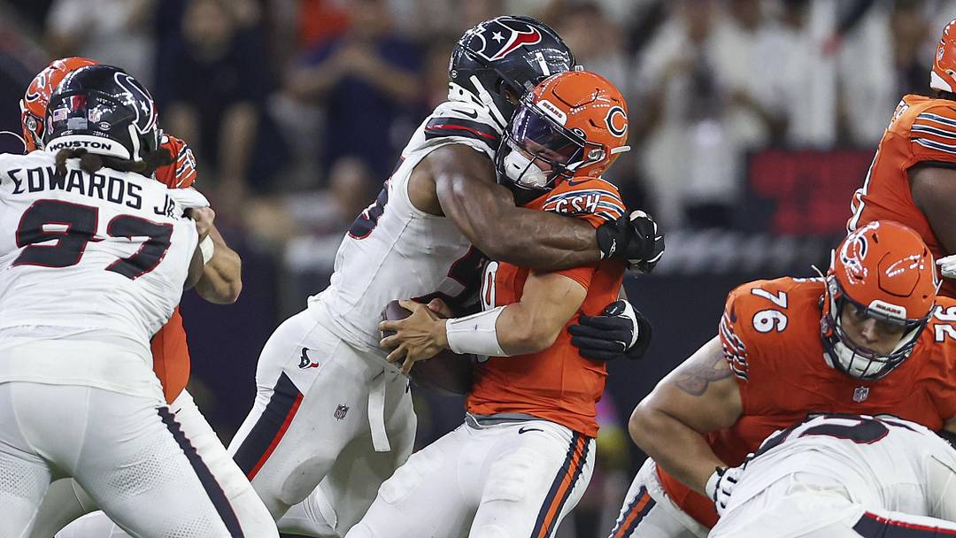 Sep 15, 2024; Houston, Texas, USA; Houston Texans defensive end Danielle Hunter (55) tackles Chicago Bears quarterback Caleb Williams (18) during the fourth quarter at NRG Stadium. Mandatory Credit: Troy Taormina-Imagn Images