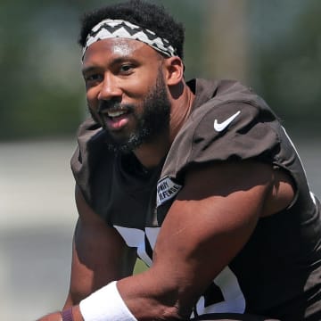 Browns defensive end Myles Garrett relaxes on the sideline during minicamp, Wednesday, June 12, 2024, in Berea.