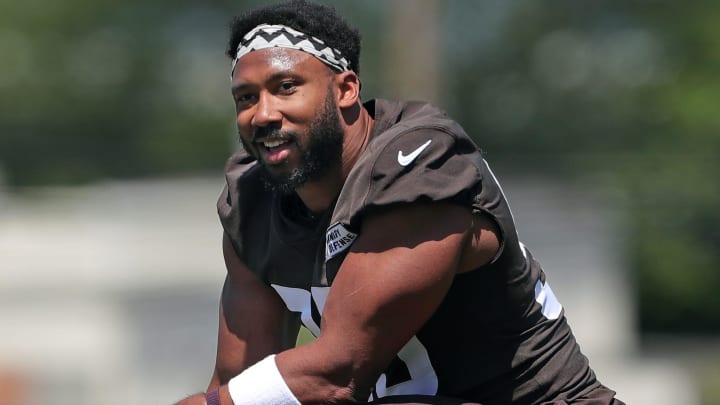 Browns defensive end Myles Garrett relaxes on the sideline during minicamp, Wednesday, June 12, 2024, in Berea.