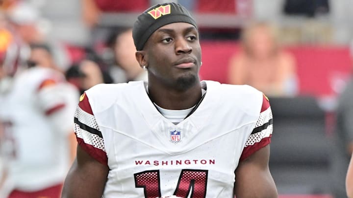 Sep 29, 2024; Glendale, Arizona, USA; Washington Commanders wide receiver Olamide Zaccheaus (14) looks on prior to the game against the Arizona Cardinals at State Farm Stadium. Mandatory Credit: Matt Kartozian-Imagn Images Sep 29, 2024; Glendale, Arizona, USA; Washington Commanders wide receiver Olamide Zaccheaus (14) looks on prior to the game against the Arizona Cardinals at State Farm Stadium. Mandatory Credit: Matt Kartozian-Imagn Images