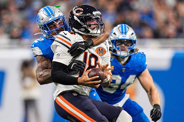 Detroit Lions safety Brian Branch (32) sacks Chicago Bears quarterback Caleb Williams.