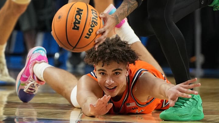 Mar 21, 2026; Greenville, SC, USA; Illinois Fighting Illini guard Keaton Wagler (23) looks at the ball as VCU Rams guard Terrence Hill Jr. (6) picks it up during the NCAA Tournament.