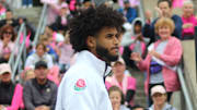 Oregon football quarterback Dante Moore speaks about his mother who had breast cancer during a rally for the Power of Pink Breast Cancer Awareness Walk at Autzen Stadium on Oct. 5, 2025.
