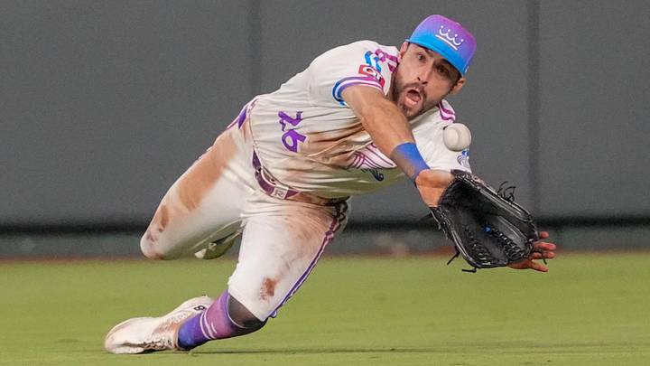 Jun 12, 2026; Kansas City, Missouri, USA; Kansas City Royals center fielder Kameron Misner (26) makes a diving catch against the Houston Astros during the seventh inning but then can’t hang onto the ball at Kauffman Stadium. Mandatory Credit: Denny Medley-Imagn Images