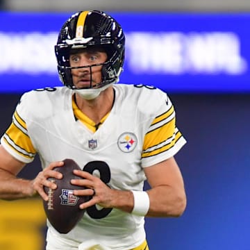 Nov 9, 2025; Inglewood, California, USA; Pittsburgh Steelers quarterback Aaron Rodgers (8) scrambles with the ball against the Los Angeles Chargers during the first quarter of the game at SoFi Stadium. Mandatory Credit: Gary A. Vasquez-Imagn Images