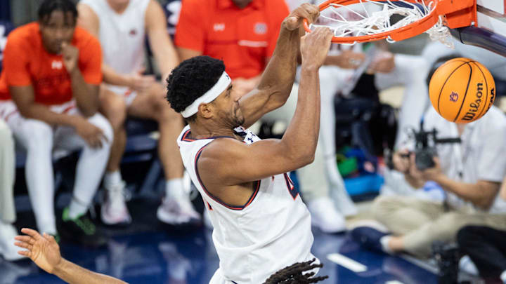Auburn Tigers center Dylan Cardwell (44) dunks the ball as Auburn Tigers take on Georgia State Panthers at Neville Arena in Auburn, Ala., on Tuesday, Dec. 17, 2024. Auburn Tigers defeated Georgia State Panthers 100-59.