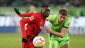 Randal Kolo Muani battling it out during a game between Frankfurt and Wolfsburg