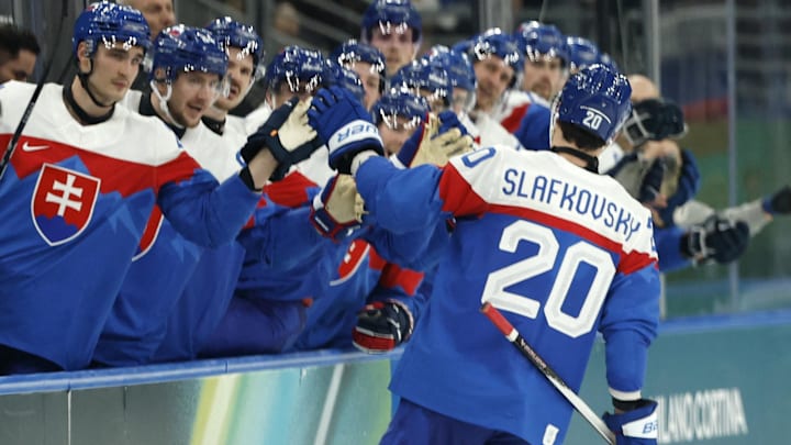 Feb 11, 2026; Milan, Italy;  Juraj Slafkovsky of Slovakia celebrates scoring their third goal with teammates against Finland in men's ice hockey group B play during the Milano Cortina 2026 Olympic Winter Games at Milano Santagiulia Ice Hockey Arena. Mandatory Credit: Geoff Burke-Imagn Images