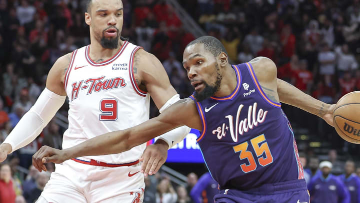 Feb 23, 2024; Houston, Texas, USA; Phoenix Suns forward Kevin Durant (35) controls the ball as Houston Rockets forward Dillon Brooks (9) defends during the fourth quarter at Toyota Center. Mandatory Credit: Troy Taormina-USA TODAY Sports