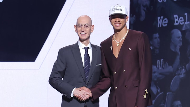 Jun 25, 2025; Brooklyn, NY, USA;  Carter Bryant stands with NBA commissioner Adam Silver after being selected as the 14th pick by the San Antonio Spurs in the first round of the 2025 NBA Draft at Barclays Center. Mandatory Credit: Brad Penner-Imagn Images