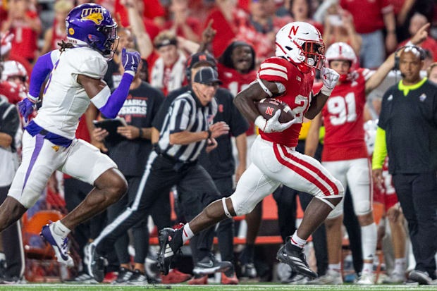 Nebraska running back Emmett Johnson races 36 yards for a fourth quarter touchdown during Nebraska's 34-3 victory against UNI