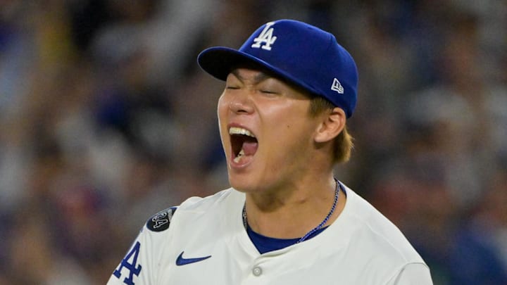 Oct 1, 2025; Los Angeles, California, USA; Los Angeles Dodgers starting pitcher Yoshinobu Yamamoto (18) celebrates after throwing against the Cincinnati Reds in the sixth inning during game two of the Wildcard round for the 2025 MLB playoffs at Dodger Stadium.