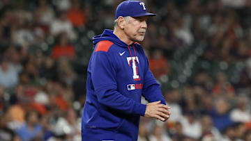 Sep 17, 2025; Houston, Texas, USA; Texas Rangers manager Bruce Bochy (15) walks to the mound to change pitchers against the Houston Astros in the seventh inning at Daikin Park.