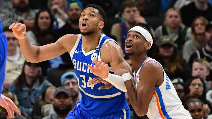 Mar 16, 2025; Milwaukee, Wisconsin, USA;  Milwaukee Bucks forward Giannis Antetokounmpo (34) and Oklahoma City Thunder guard Shai Gilgeous-Alexander (2) jostles for position under the basket in the second quarter at Fiserv Forum. Mandatory Credit: Benny Sieu-Imagn Images