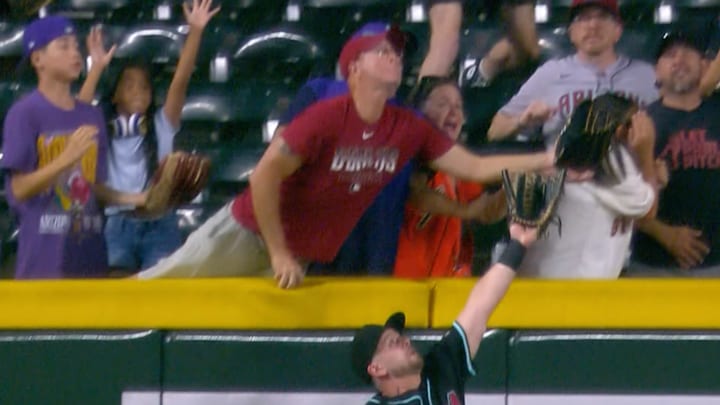 Diamondbacks fan finds another way into the action. Diamondbacks fan finds another way into the action.