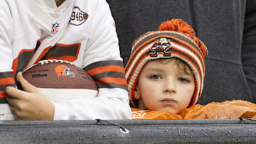 Dec 29, 2024; Cleveland, Ohio, USA; A Cleveland Browns fan watches warmups before the game against the Miami Dolphins at Huntington Bank Field. Mandatory Credit: Scott Galvin-Imagn Images