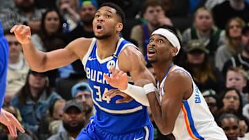 Mar 16, 2025; Milwaukee, Wisconsin, USA;  Milwaukee Bucks forward Giannis Antetokounmpo (34) and Oklahoma City Thunder guard Shai Gilgeous-Alexander (2) jostles for position under the basket in the second quarter at Fiserv Forum. Mandatory Credit: Benny Sieu-Imagn Images